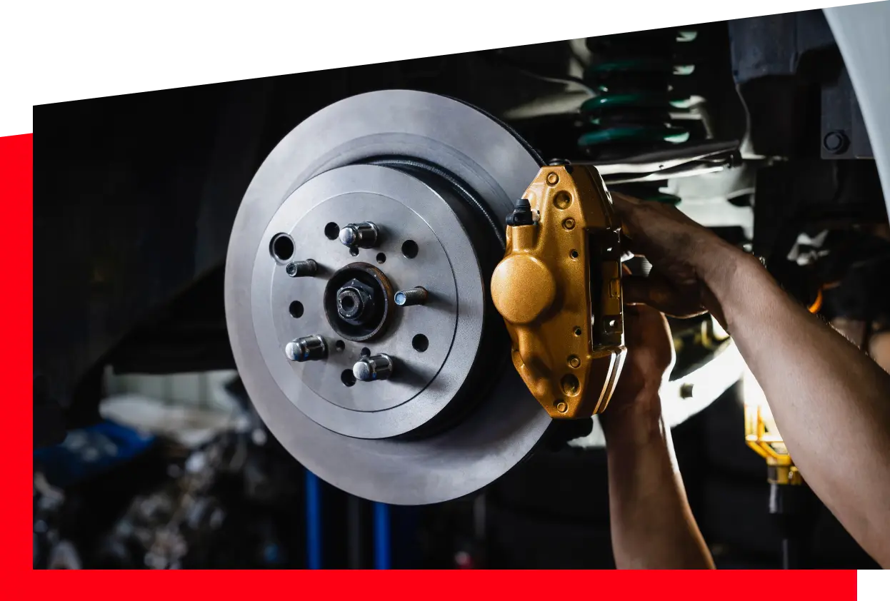 A person fixing car brakes